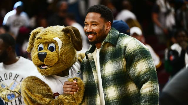 Apr 18, 2023; Cleveland, Ohio, USA; Cleveland Browns player Myles Garrett poses for a photo with Cleveland Cavaliers mascot Moondog after the Cavaliers beat the New York Knicks in game two of the 2023 NBA playoffs at Rocket Mortgage FieldHouse.